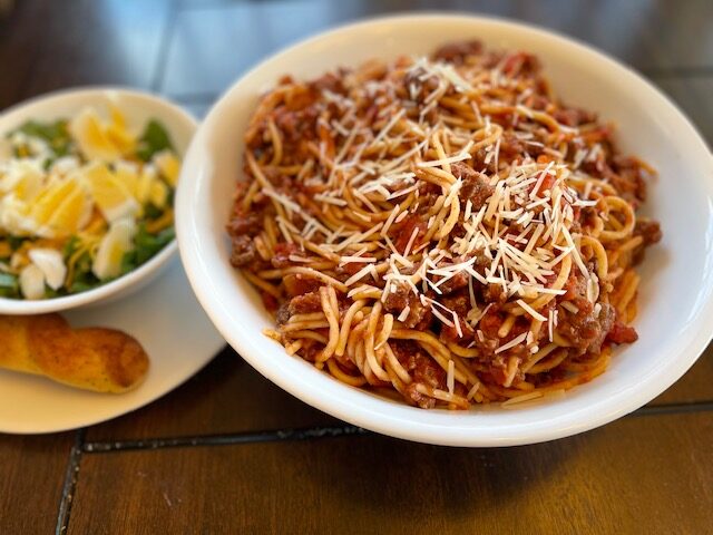 Homemade spaghetti sauce with meat over pasta