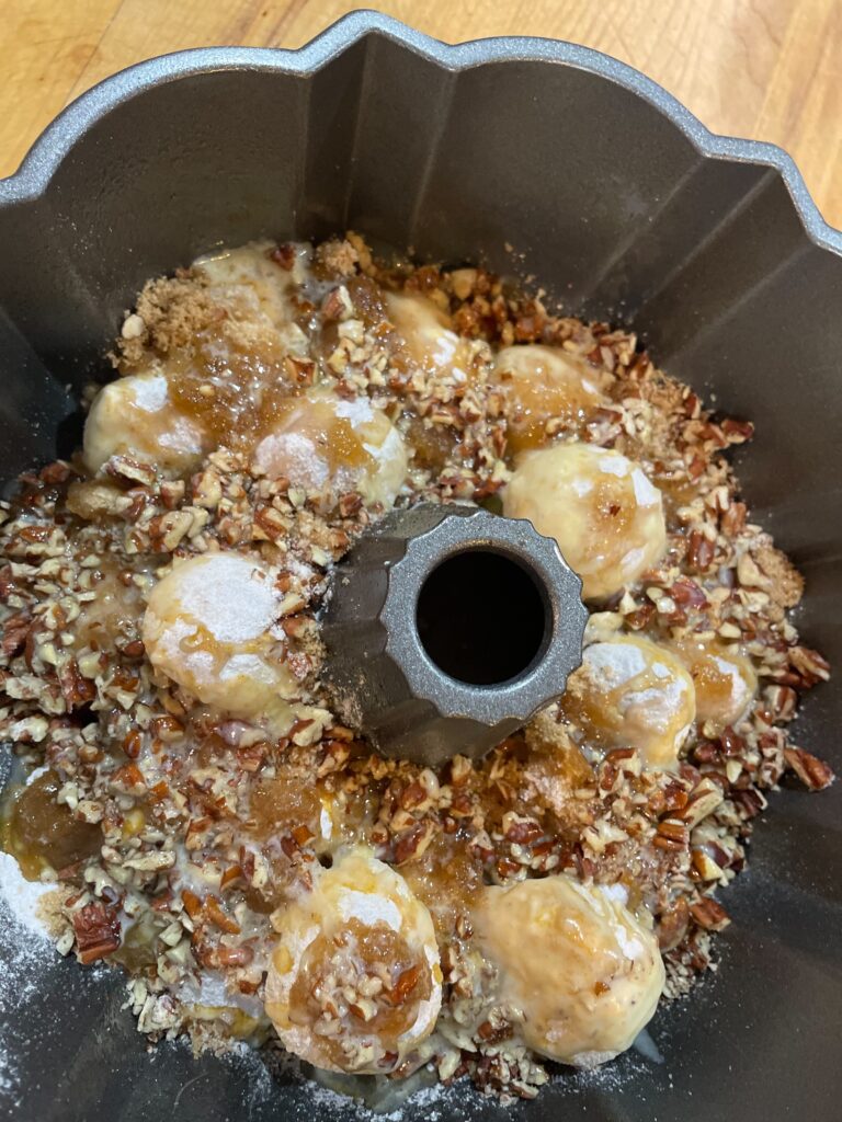 pecan sticky rolls in Bundt pan before cooking